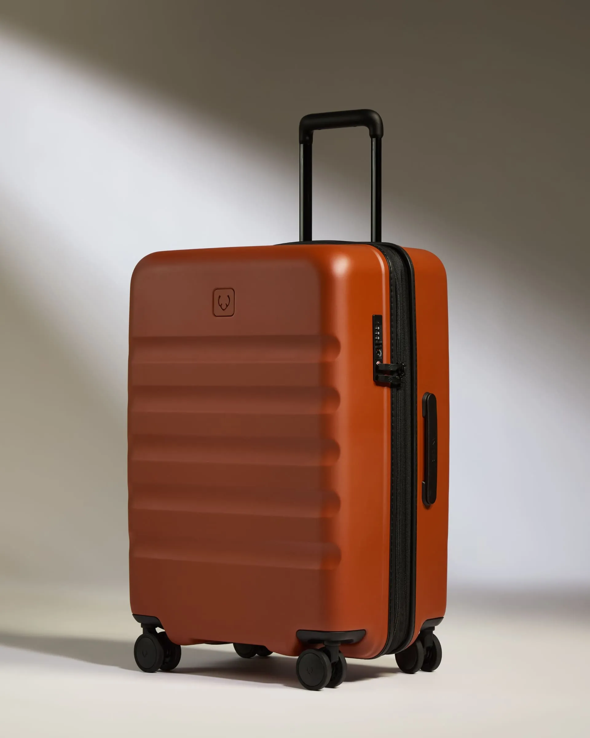 Medium Suitcase in Maple Red - Icon Stripe