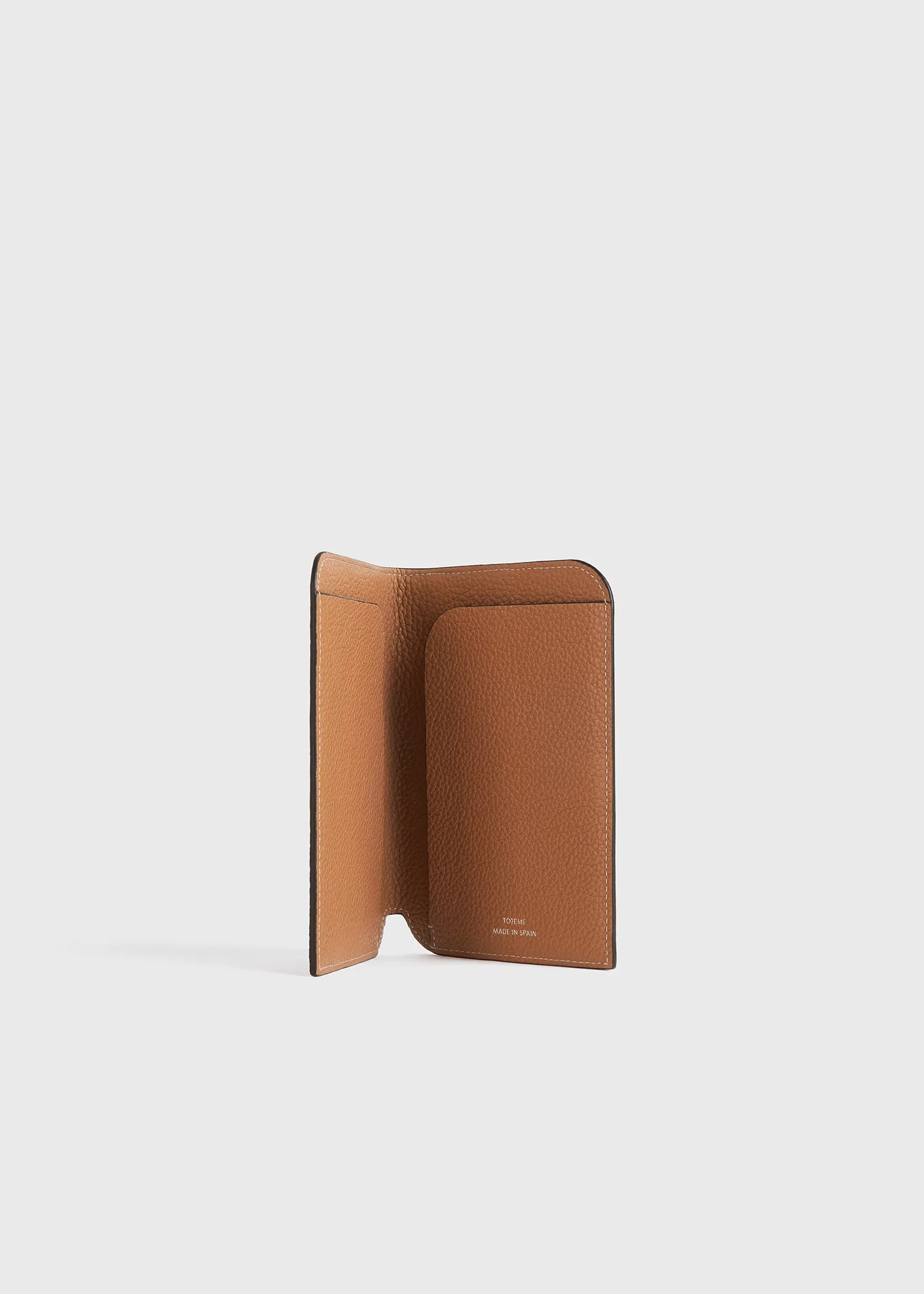 Monogram leather passport holder tan grain